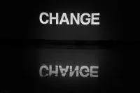 a black and white photo of the word change