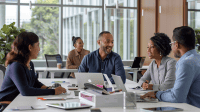 professionals in business casual attire collaborating on human performance evaluation in an office.